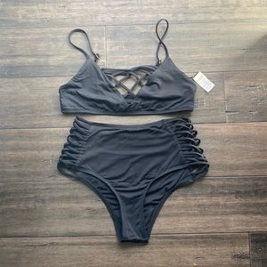 Lspace bikini. Size medium top with small cheeky bottoms. Tag partially off top.